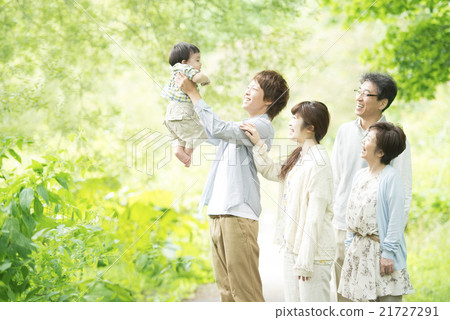 Three generations family smiling in fresh green Three generations family smiling in fresh green 21727291