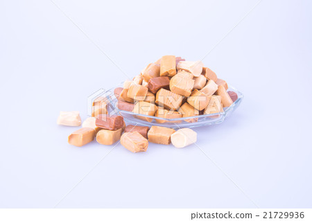 caramel candies on a background. caram 21729936