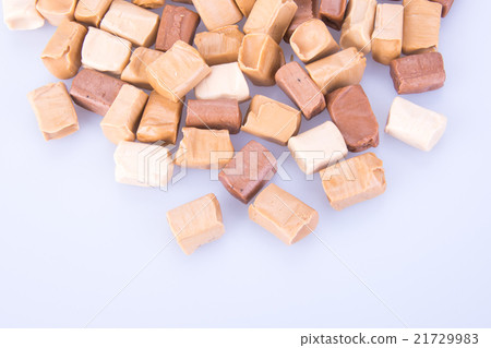caramel candies on a background. caram 21729983