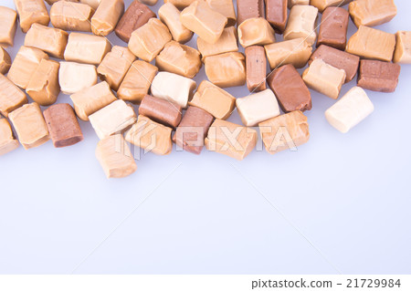 caramel candies on a background. caram 21729984