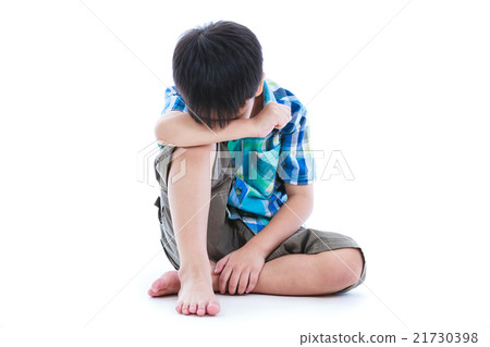 Little sad boy barefeet sitting on floor. Isolated 21730398