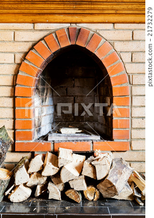 not kindled brick fireplace and wood logs 21732279