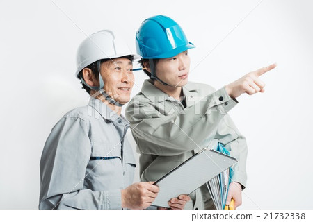 Two men with hard hats at construction site stock photo