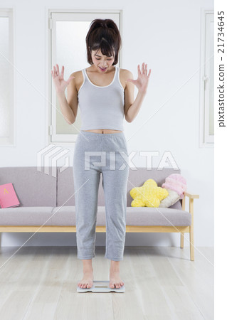 A woman on a scale 21734645