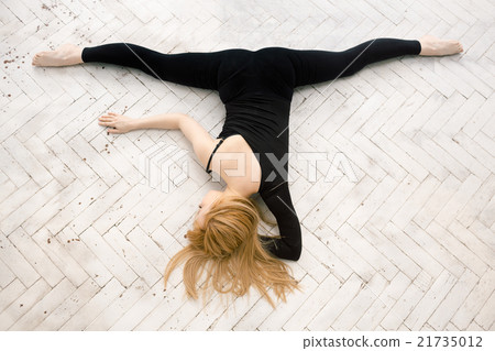 Young attractive female fitness woman performing a 21735012