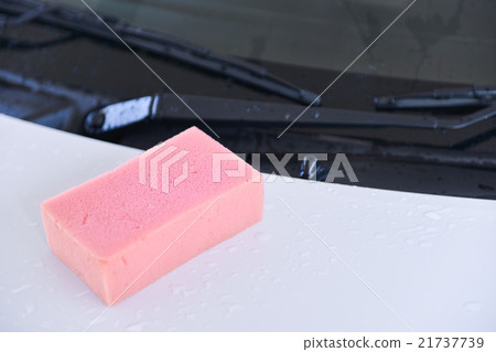 soaky pink sponge on a surface of car 21737739