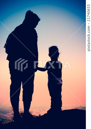 Silhouette of mother and child enjoying the view. Silhouette of mother and child enjoying the view. 21740655