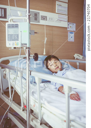 Asian boy with infusion pump intravenous IV drip. Asian boy with infusion pump intravenous IV drip. 21740704