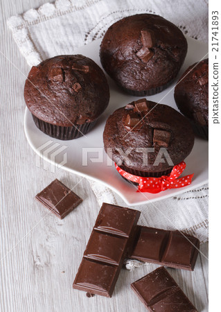 Chocolate muffins on a white plate top view 21741893