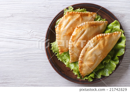 stuffed empanadas on a plate. view from above 21742829