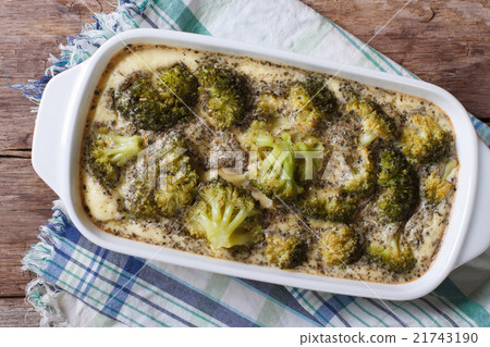 Baked broccoli with spices and herbs top view 21743190