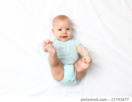 happy newborn baby on bed happy newborn baby on bed 21743877