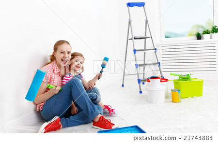 happy family mother and child daughter making repairs, paint wal happy family mother and child daughter making repairs, paint wal 21743883
