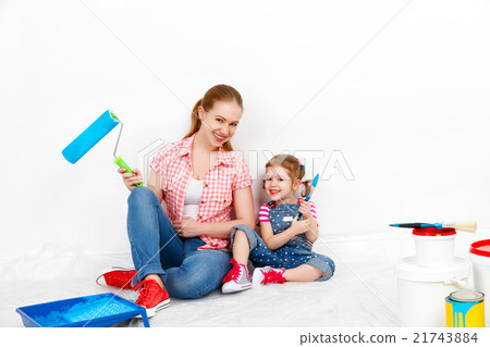 happy family mother and child daughter making repairs, paint wal 21743884