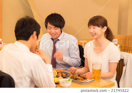 Young men and women playing drinking party 21745822