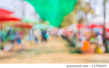 Blurred image of people walking at day market 21746849