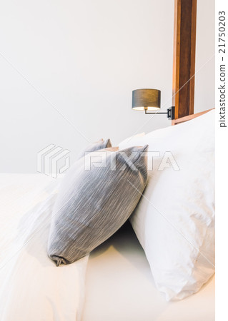 White pillow on bed White pillow on bed 21750203