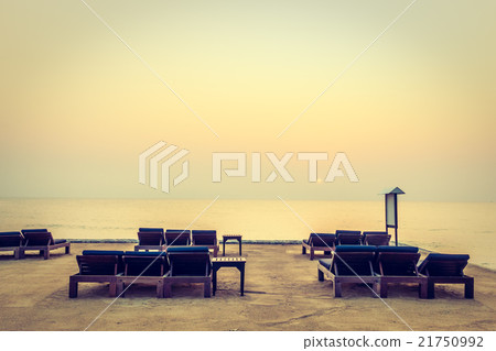 Empty chair on the beach Empty chair on the beach 21750992