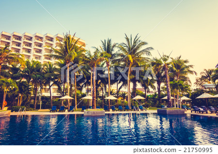 Beautiful Silhouette palm tree with umbrella and chair Beautiful Silhouette palm tree with umbrella and chair 21750995
