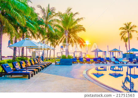 Beautiful Silhouette palm tree with umbrella and chair 21751563