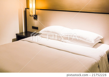 White pillow on bed 21752228