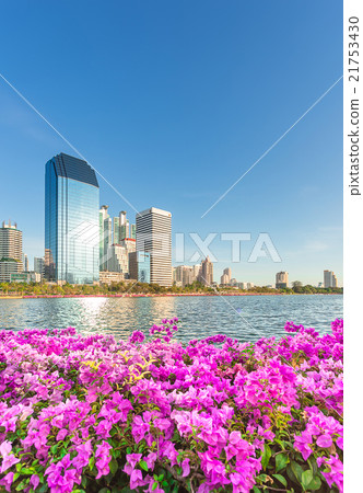 Tall building behind Benjakiti Park in Bangkok, Thailand Tall building behind Benjakiti Park in Bangkok, Thailand 21753430