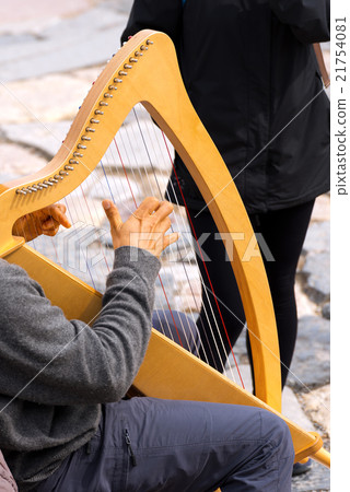 Street Musician Playing Classical Harp 21754081
