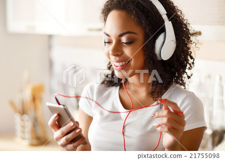 Cheerful girl listening to music Cheerful girl listening to music 21755098