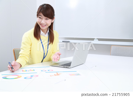 A working woman explaining the material A working woman explaining the material 21755905