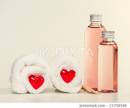 Spa background with erotic massage oil and towels. 21756566