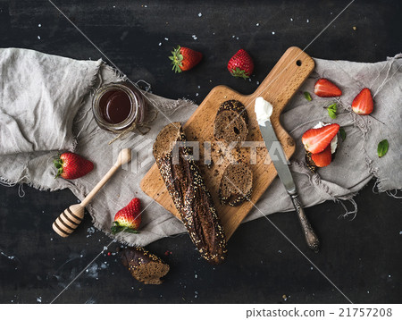 Breakfast set. Black baguette toasts with fresh 21757208