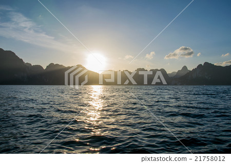 Sun rise behind mountain at Khao Sok National Park Sun rise behind mountain at Khao Sok National Park 21758012