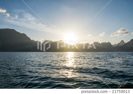 Sun rise behind mountain at Khao Sok National Park 21758013
