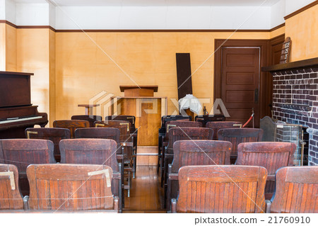 Empty witness chair inside a classic courtroom. 21760910