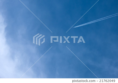 An airplane cloud extending into the blue sky An airplane cloud extending into the blue sky 21762049