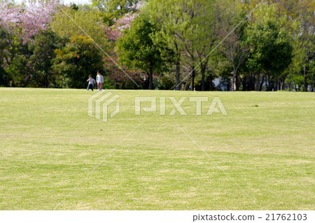 Piazza with lawn Image of children playing far away b 21762103