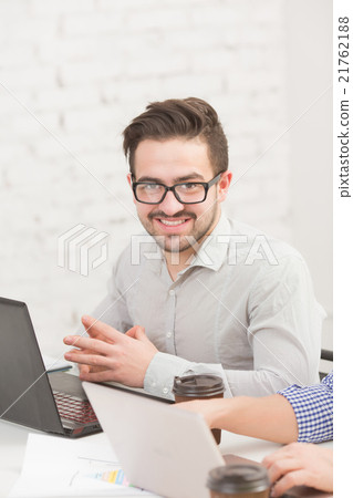 Businessman in office Businessman in office 21762188