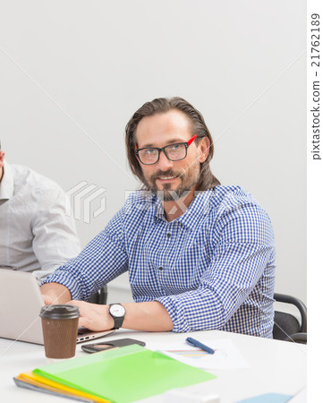Businessman in office Businessman in office 21762189