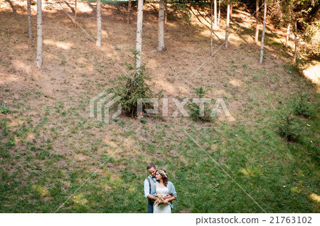 beautiful couple hugging near a mountain river 21763102