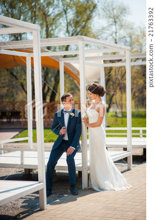 Bride and groom walking at the river 21763392