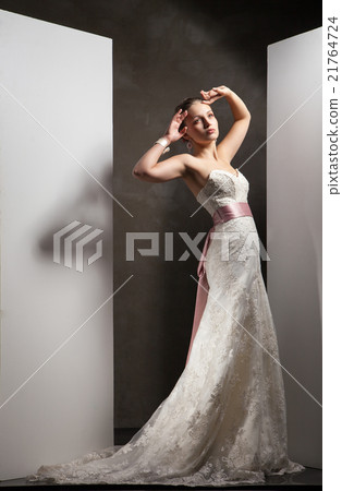 The beautiful young woman in a wedding dress 21764724
