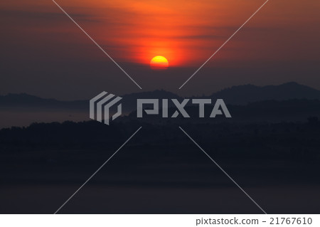 Misty sunrise in the mountain 21767610