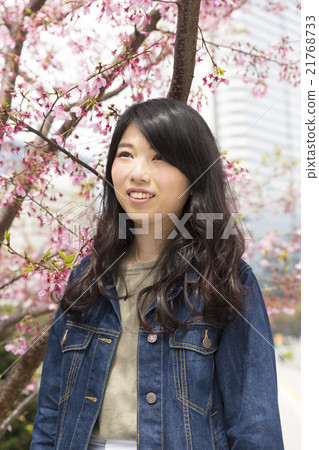 Female portrait outside Spring cherry upper body casual looking far away Female portrait outside Spring cherry upper body casual looking far away 21768733