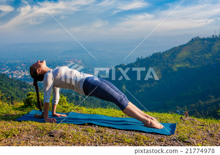 Woman doing Hatha yoga asana Purvottanasana 21774978