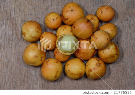 Rambi tropical fruit on wooden board Rambi tropical fruit on wooden board 21776555