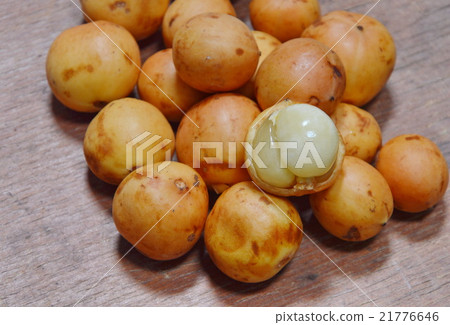 Rambi tropical fruit on wooden board Rambi tropical fruit on wooden board 21776646
