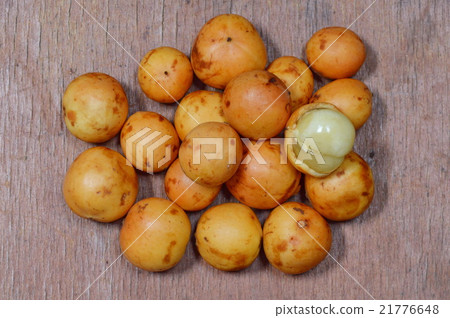 Rambi tropical fruit on wooden board Rambi tropical fruit on wooden board 21776648
