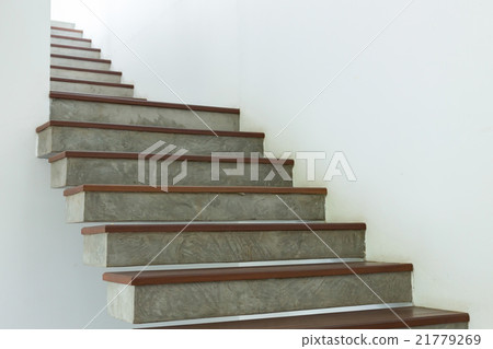 cement and wood staircase on white mortar wall 21779269
