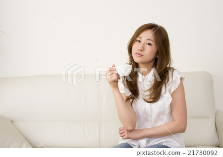 A woman thinking about troubles while drinking coffee 21780092