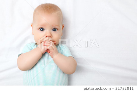 happy newborn baby on bed 21782011